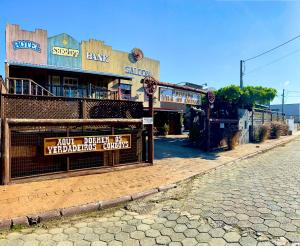 a building on the side of a street at Pousada Vila do Cowboy in Penha +53 photos