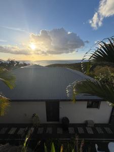 a roof of a building with a view of the ocean at Villa zion in Deshaies