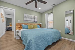 a bedroom with a bed and a ceiling fan at Kayaks & River Access Easy Parking Beautiful in Gladwyne