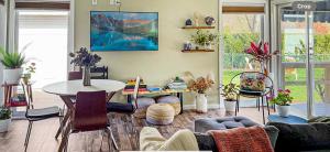 a living room with a table and a couch at Kayaks & River Access Easy Parking Beautiful in Gladwyne