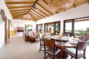 a dining room with a table and chairs at Baan Apsara - Stunning Sea View 3 Bed Pool Villa in Choeng Mon Beach