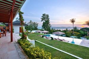 a view of the backyard of a villa at Baan Apsara - Stunning Sea View 3 Bed Pool Villa in Choeng Mon Beach