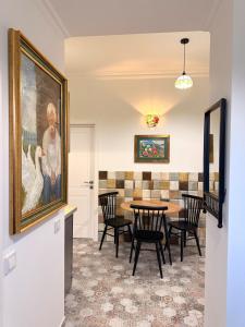 a dining room with a table and chairs at Федорцьо in Mukacheve