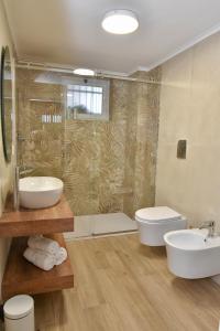 a bathroom with a sink and a toilet and a shower at miem's home in San Giuseppe Vesuviano