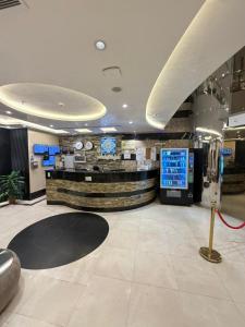 a lobby with a check in counter in a building at Etqan Al Mashair Two in Mecca