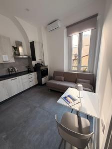 a living room with a couch and a table at Le Cisterne Guest house Suite&Rooms in Vasto