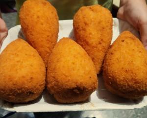 a plate of food with some fried wontons at Nino's House in Sperlinga +31 photos