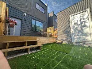 a backyard with a bench and a house at Modern House with Aurora Views in Yellowknife