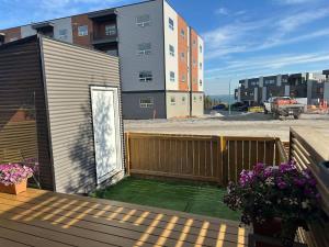 a balcony with a wooden fence and a building at Modern House with Aurora Views in Yellowknife +17 photos