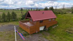 an overhead view of a house with a red roof at Secret lagoon cabin in Fludir