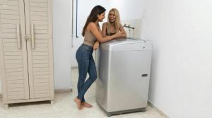 two women are standing next to a water heater at Mom's House Floralia in Cali