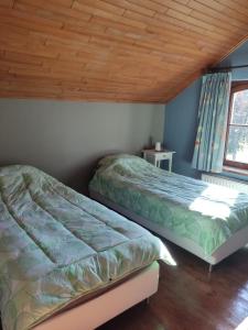 Llit o llits en una habitació de Ferme Moulin Henrot