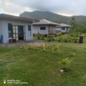 a house with a lawn in front of it at Hitimahana lodge in Fare +3 photos