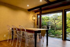 a dining room with a table and chairs at 宮島 Shinwa in Miyajima