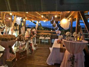 a room with a table and a person in the air at Jobos Beach House - Steps from the beach! in Isabela +51 photos