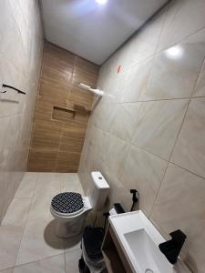 a bathroom with a toilet and a sink at Visão do Céu in Viçosa do Ceará +20 photos