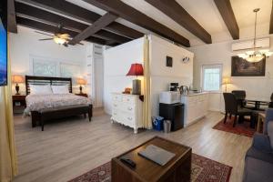 a bedroom with a bed and a living room at Cecil Bacon Manor in Seattle