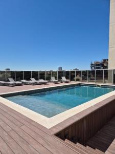a swimming pool on the roof of a building at Molas 112B in Asunción