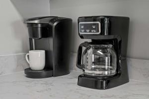 a coffee maker and a cup on a counter at Bikini Bottom Destin Harbor Private Gated Beach in Destin