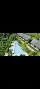 an aerial view of a house with a swimming pool at Navela in Ko Lanta
