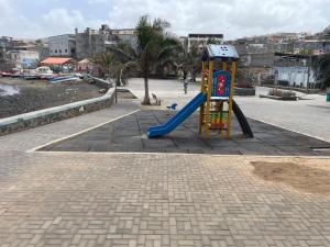 a playground with a slide in the middle of a street at Porto Calheta in Calheta