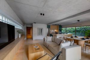 a living room with a couch and a table at Lulu Condesa by Capitalia in Mexico City