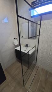 a bathroom with a sink and a mirror at Ouakam Monument de la Renaissance 2 in Dakar +19 photos