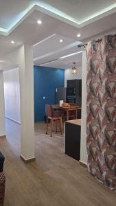 a living room with a couch and a table at Ouakam Monument de la Renaissance 2 in Dakar