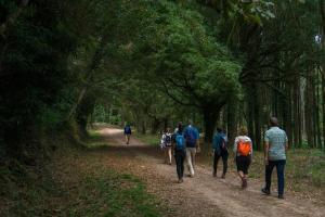 a group of people walking down a dirt road at CarriCHe 3 in Lisbon