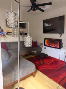 a living room with a couch and a fireplace at Comfort House in Manuel F. Martínez