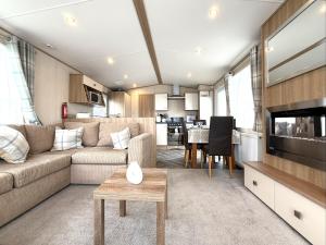 a living room with a couch and a table at The Haven in Filey
