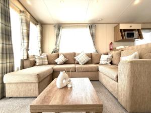 a living room with a couch and a coffee table at The Haven in Filey