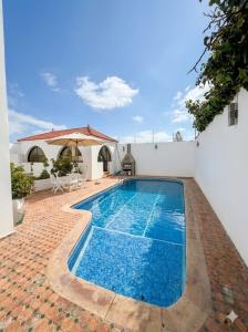 a swimming pool in the middle of a house at Palace with Private Pool in Tamaris