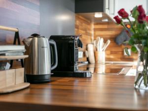 a coffee maker sitting on top of a counter at Kaiser Chalet Ebbs in Ebbs