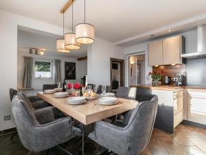 a kitchen and dining room with a table and chairs at Kaiser Chalet Ebbs in Ebbs