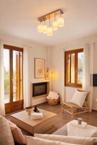 a living room with a couch and a table at Epidavros View Villas in Ancient Epidauros