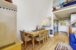 a kitchen and dining room with a table and chairs at Tranquil Tides Cottage in Langley +19 photos