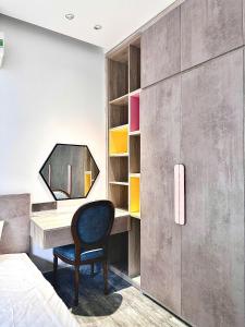 a bedroom with a desk and a chair at Win Home Huế in Hue