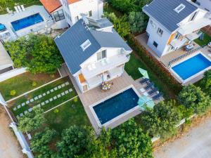 an overhead view of a house with a swimming pool at Villa Riva in Oludeniz