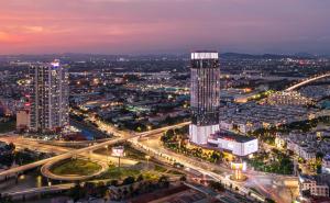 a view of a city at night with a tall building at Hotel Golden Joy Stay in Hai Phong +18 photos