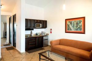 a living room with a couch and a kitchen at Villa Costera 904 | Island Escapade | Culebra in Culebra