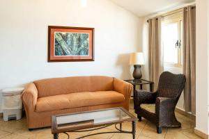 a living room with a couch and a chair at Villa Costera 904 | Island Escapade | Culebra in Culebra