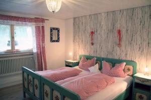En eller flere senge i et værelse på Ferienhaus Ursula