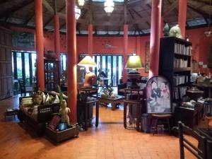 a room filled with lots of furniture and tables at NATUR - Krabi Campsite Glamping & Camping in Krabi