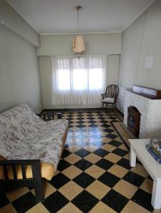 a living room with a couch and a fireplace at Sierras & Urbana in Tandil