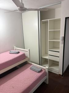a bedroom with two bunk beds and a mirror at Jerarquizado M Rentals in Santiago del Estero
