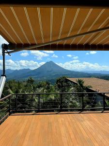 a view of a mountain from the deck of a house at Airstream Stay Private Jacuzzi & Volcano View in Monterrey
