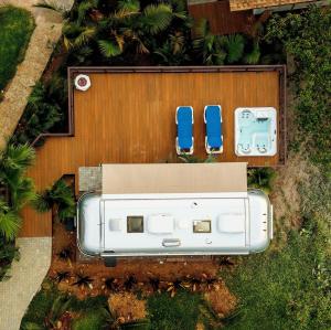 an overhead view of two blue chairs and a van at Airstream Stay Private Jacuzzi & Volcano View in Monterrey