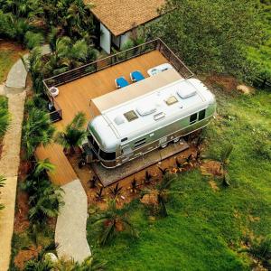 an aerial view of a house with a recreational vehicle on the roof at Airstream Stay Private Jacuzzi & Volcano View in Monterrey