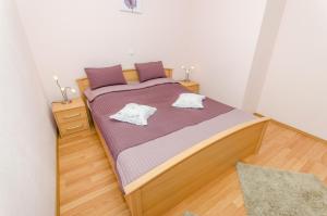 Postel nebo postele na pokoji v ubytování Apartment Iva